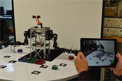 Mobile Mixed-Reality Interfaces That Enhance Human–Robot Interaction in Shared Spaces